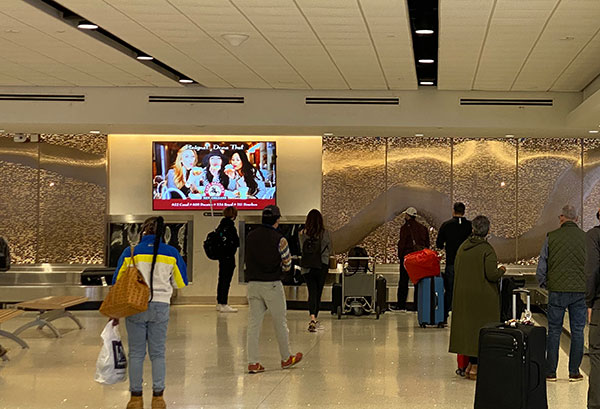 Cafe Beignet ad at MSY airport baggage claim